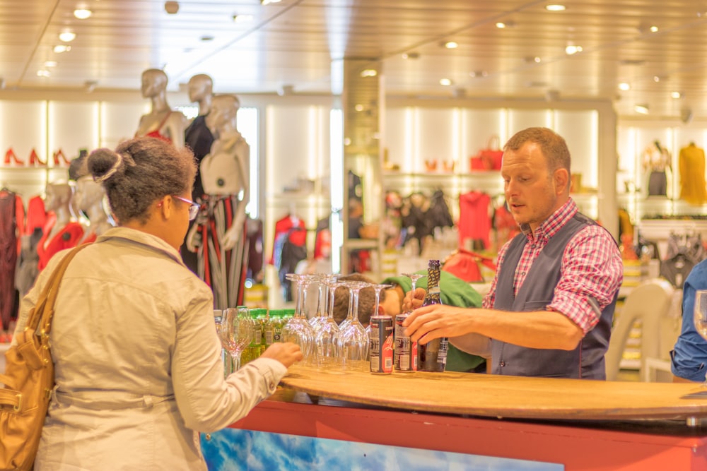 man sells beer at the department store