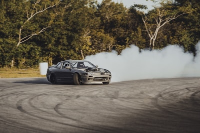 time-lapse photography of a drifting car