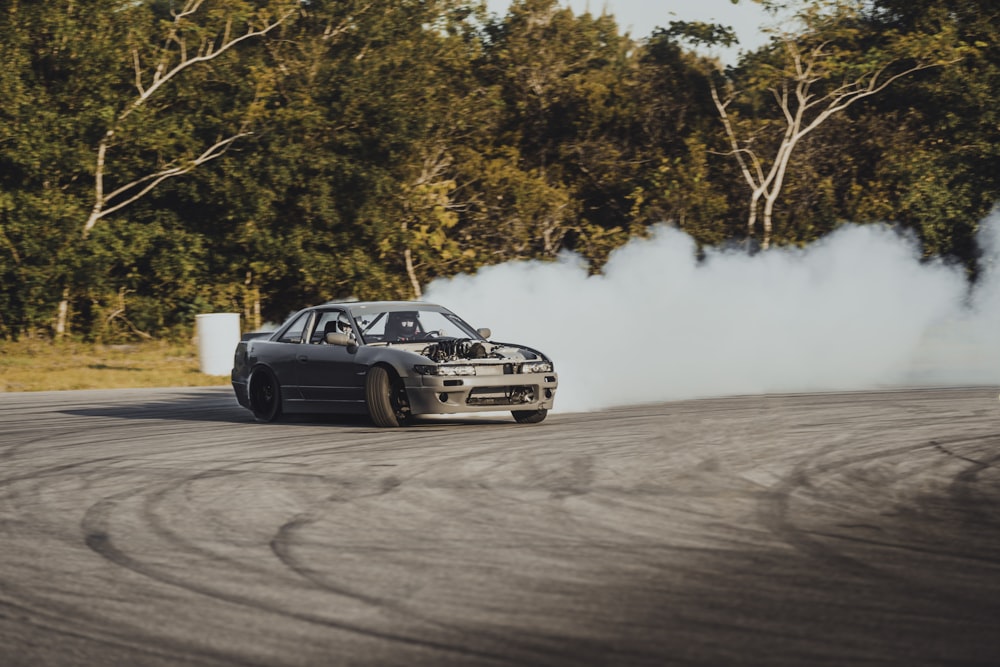 time-lapse photography of a drifting car