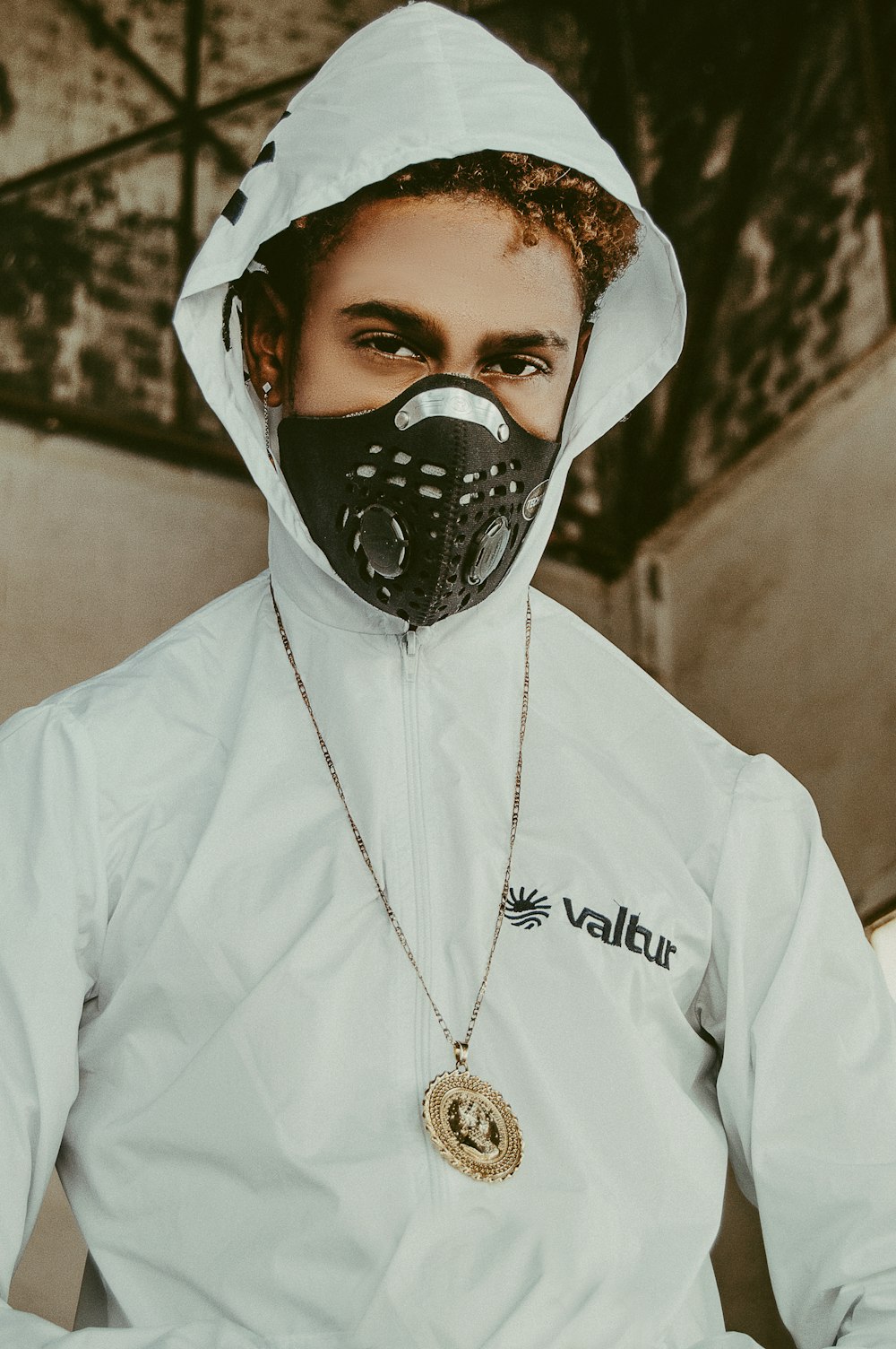 man wearing black mask and white hoodie