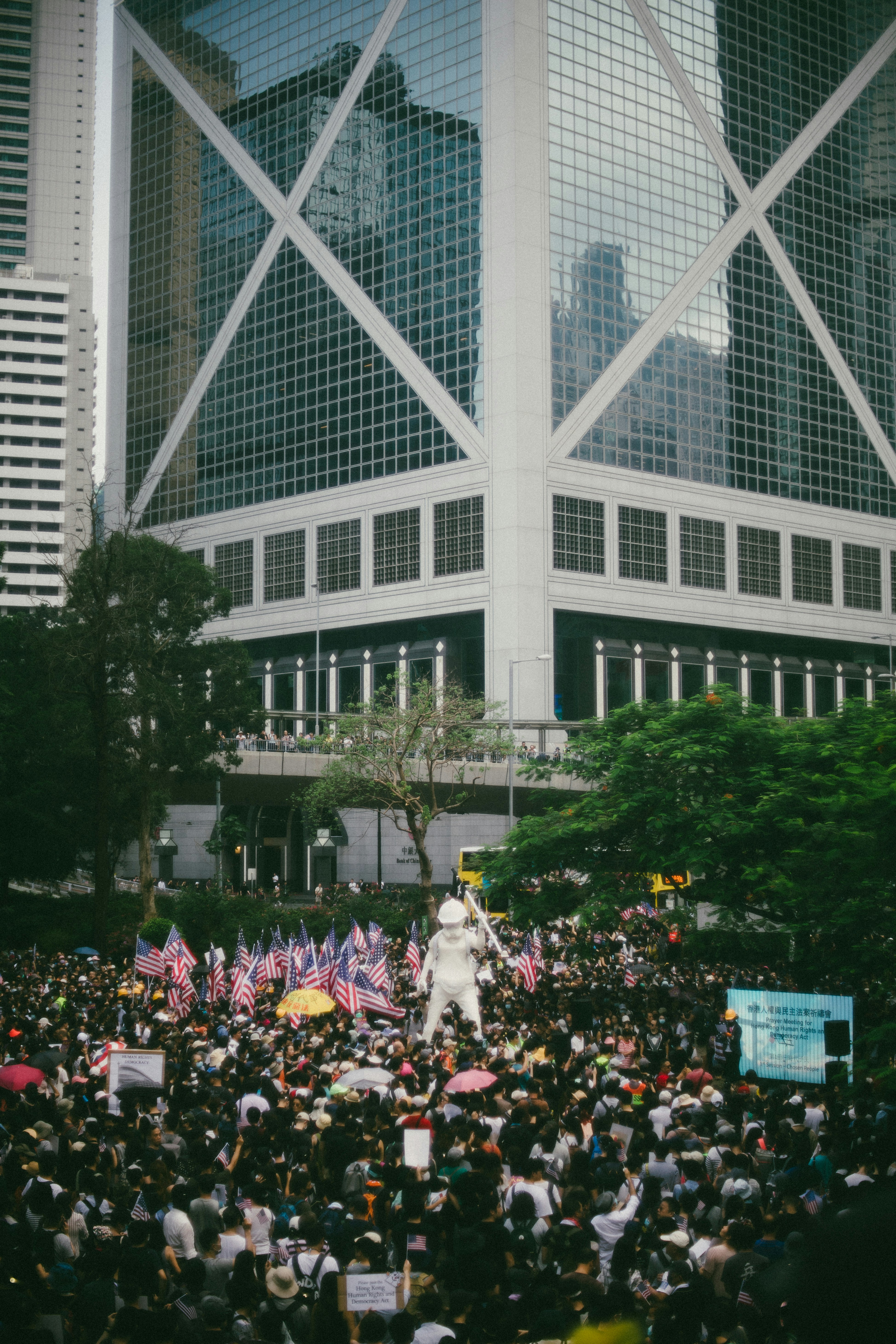 white statue surrounded by people