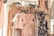 An elegant arrangement of women's fashion outfits hanging on a chic clothing rack.