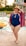 A happy customer wearing a stylish swimsuit from Way Rain LLC.