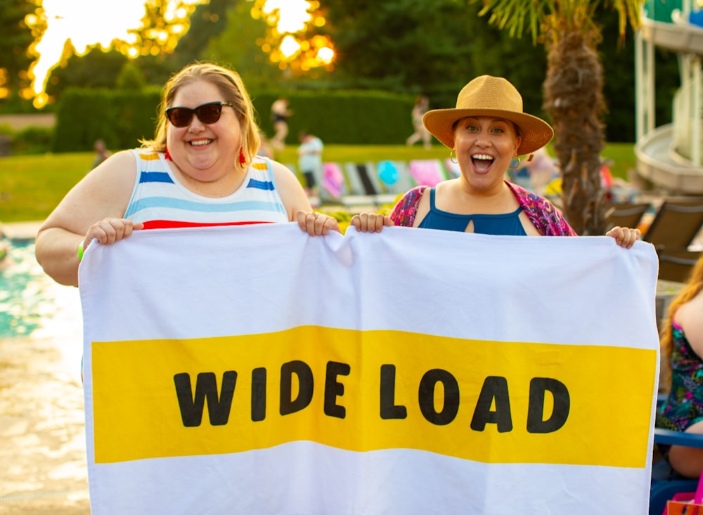 women holding banner