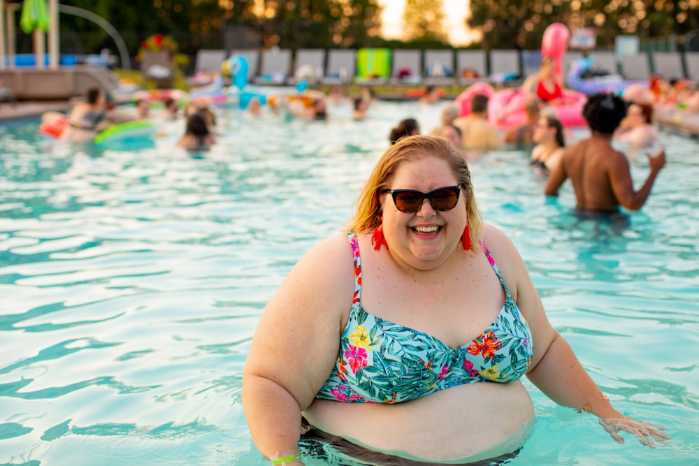 woman wearing blue and red floral bikini top on pool