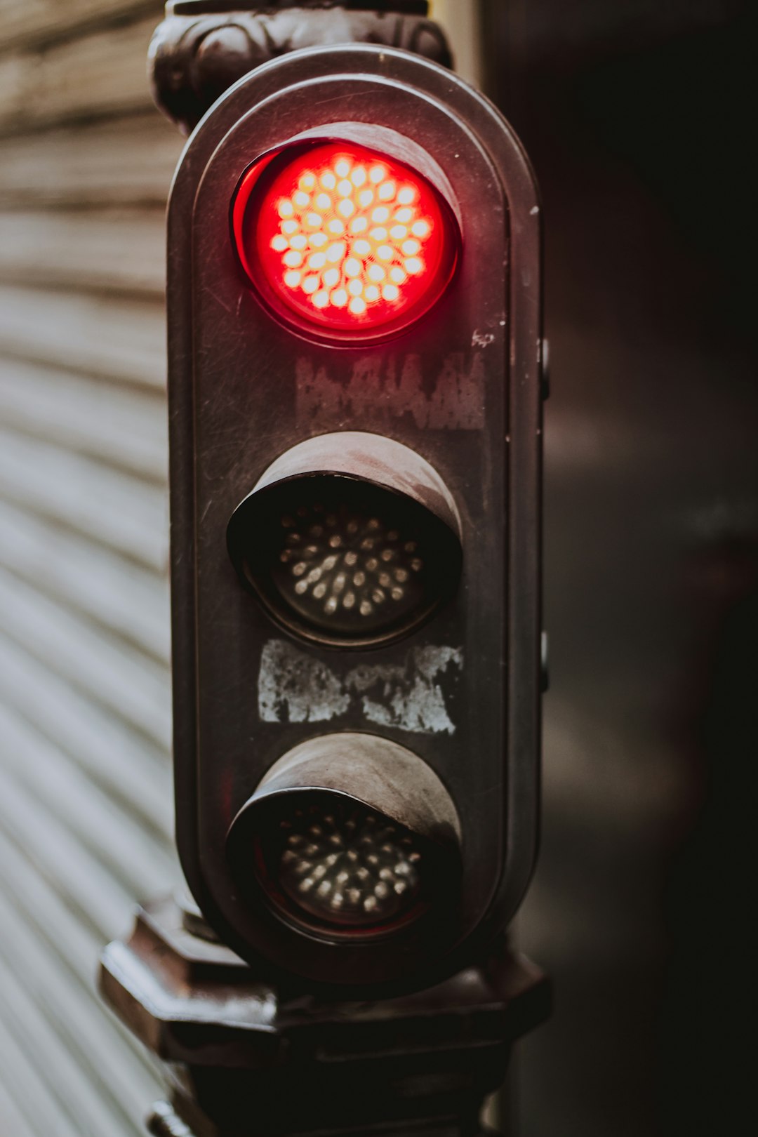 gray metal traffic light with red light
