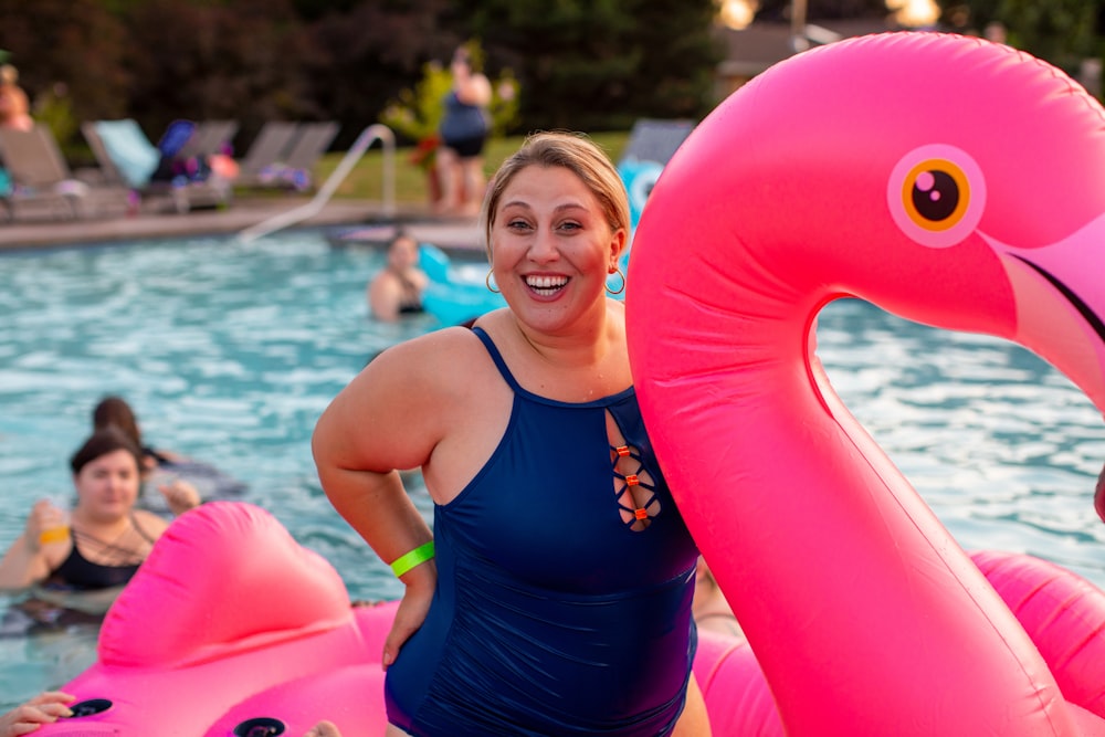 woman on pink flamingo floater