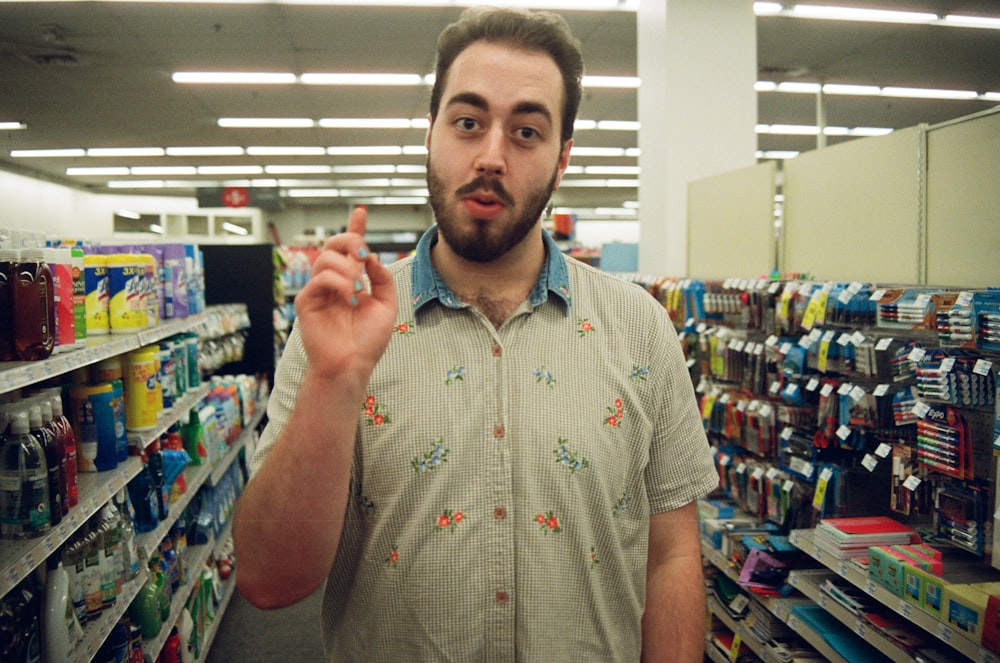 man wearing teal and gray polo shirt