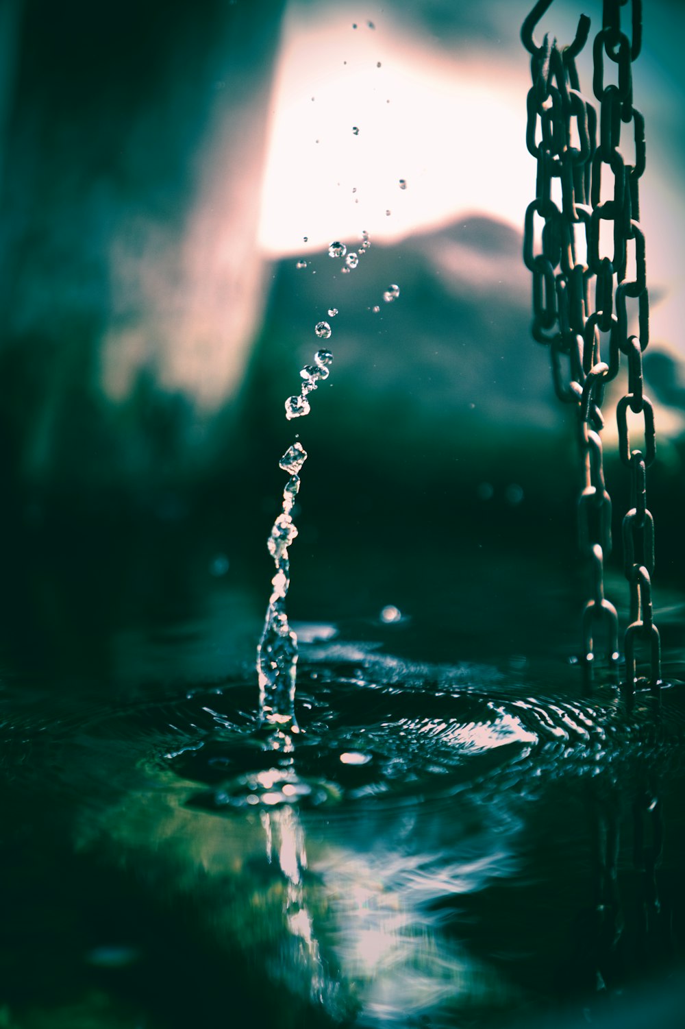 gray metal chain on body of water