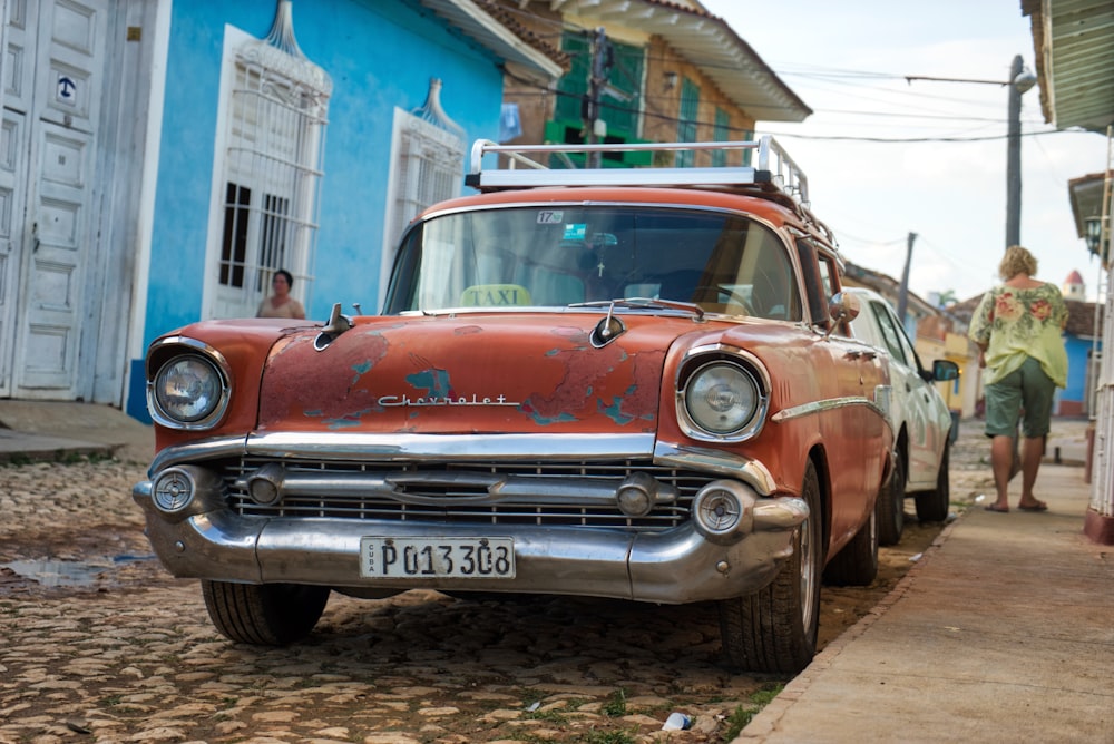 red vehicle during daytime