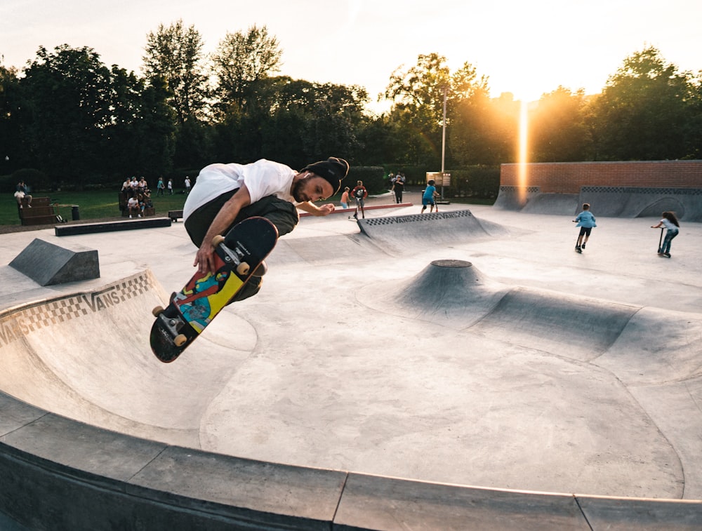 person skateboarding on gray concrete ramps