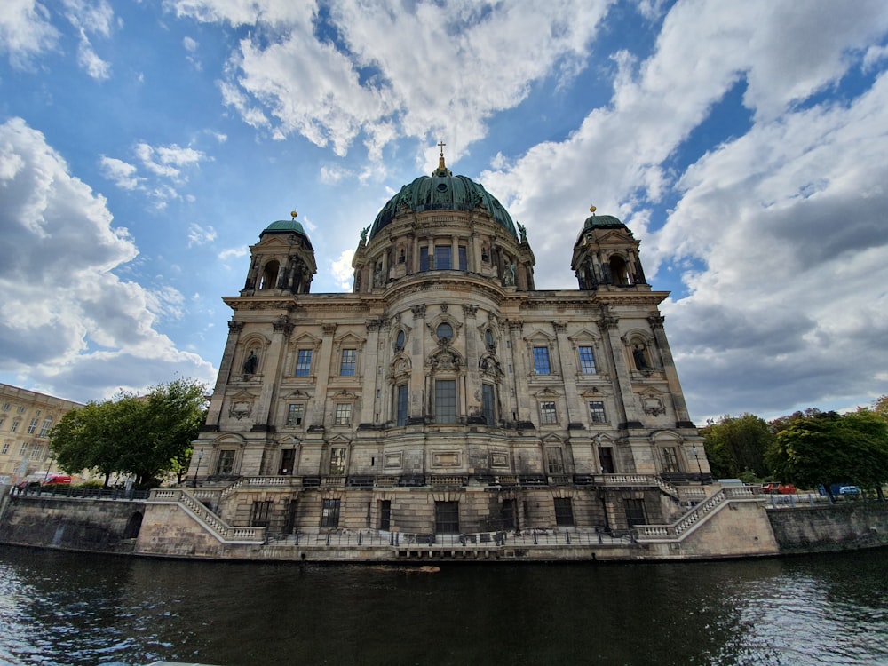 dome building beside body of water