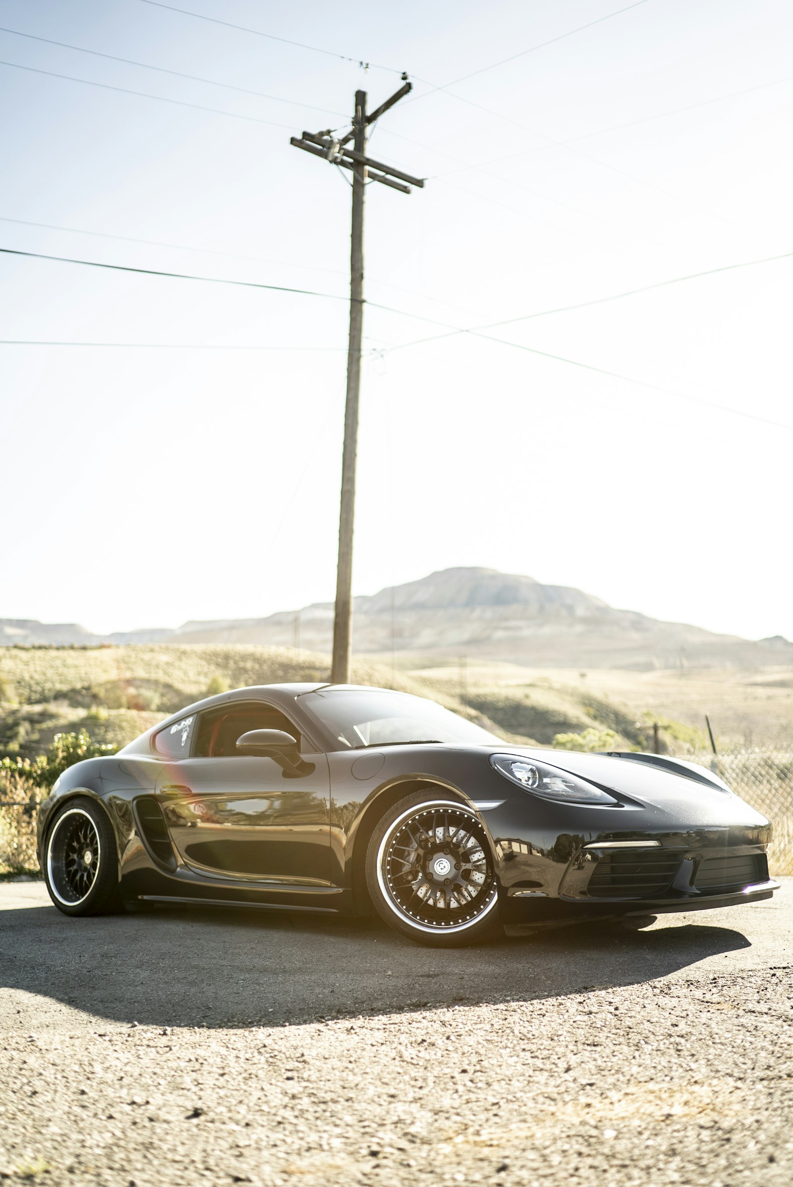 Sony a7S II + Sony Distagon T* FE 35mm F1.4 ZA sample photo. Gray coupe parked photography