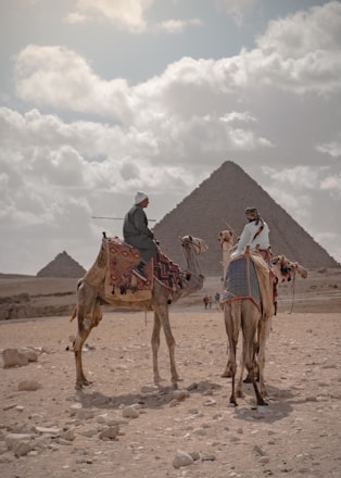 A scenic Egyptian desert safari adventure with tourists and camels