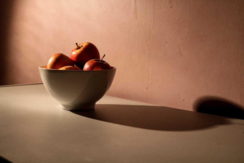 apple fruits in white bowl