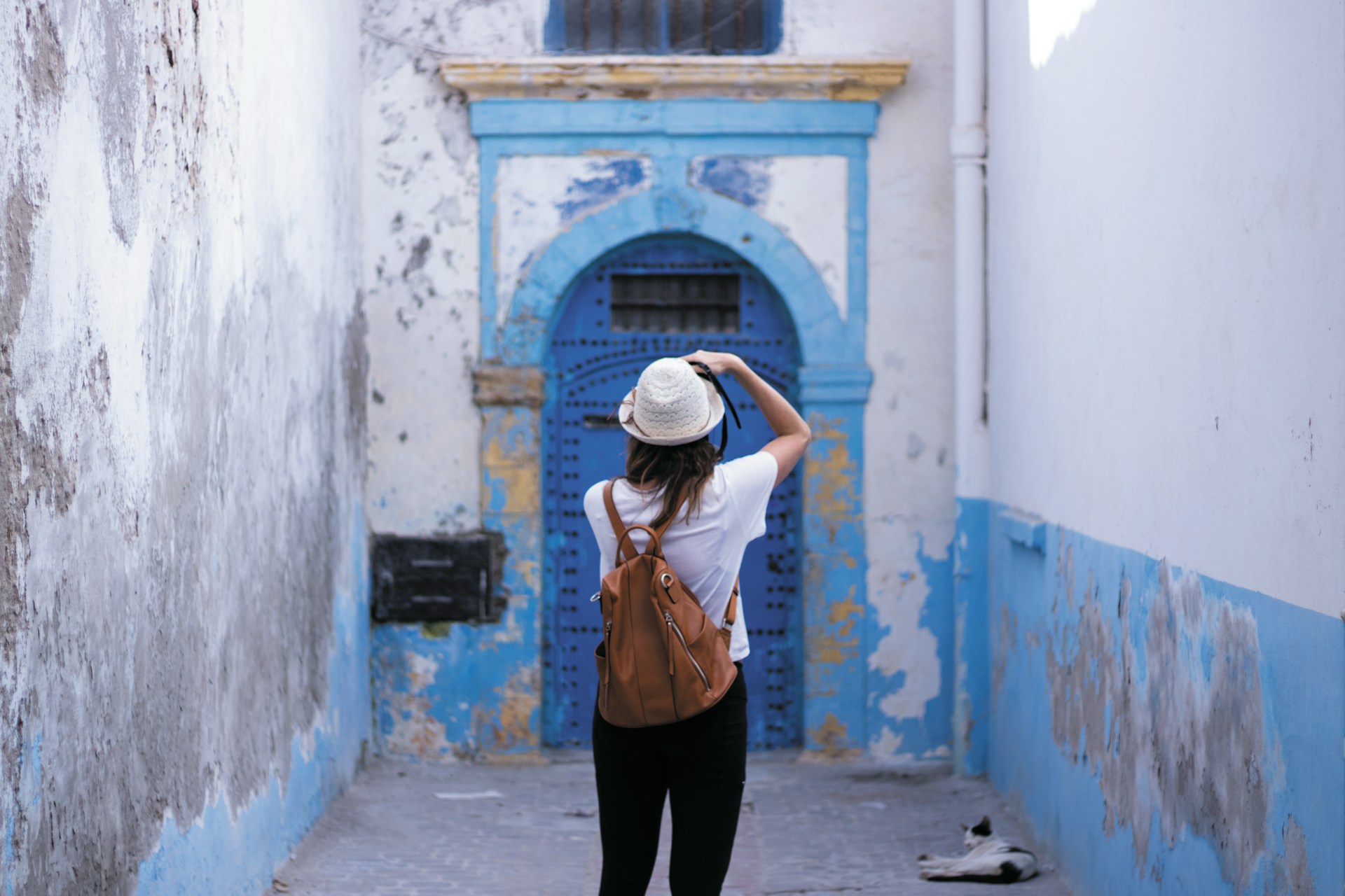 woman standing front of closed door