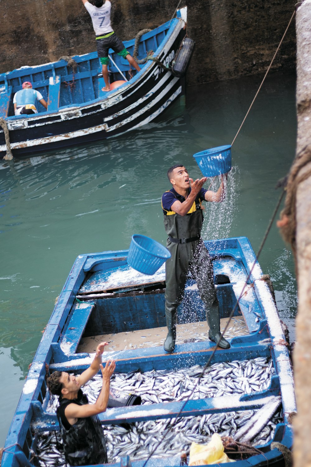 man on blue boat