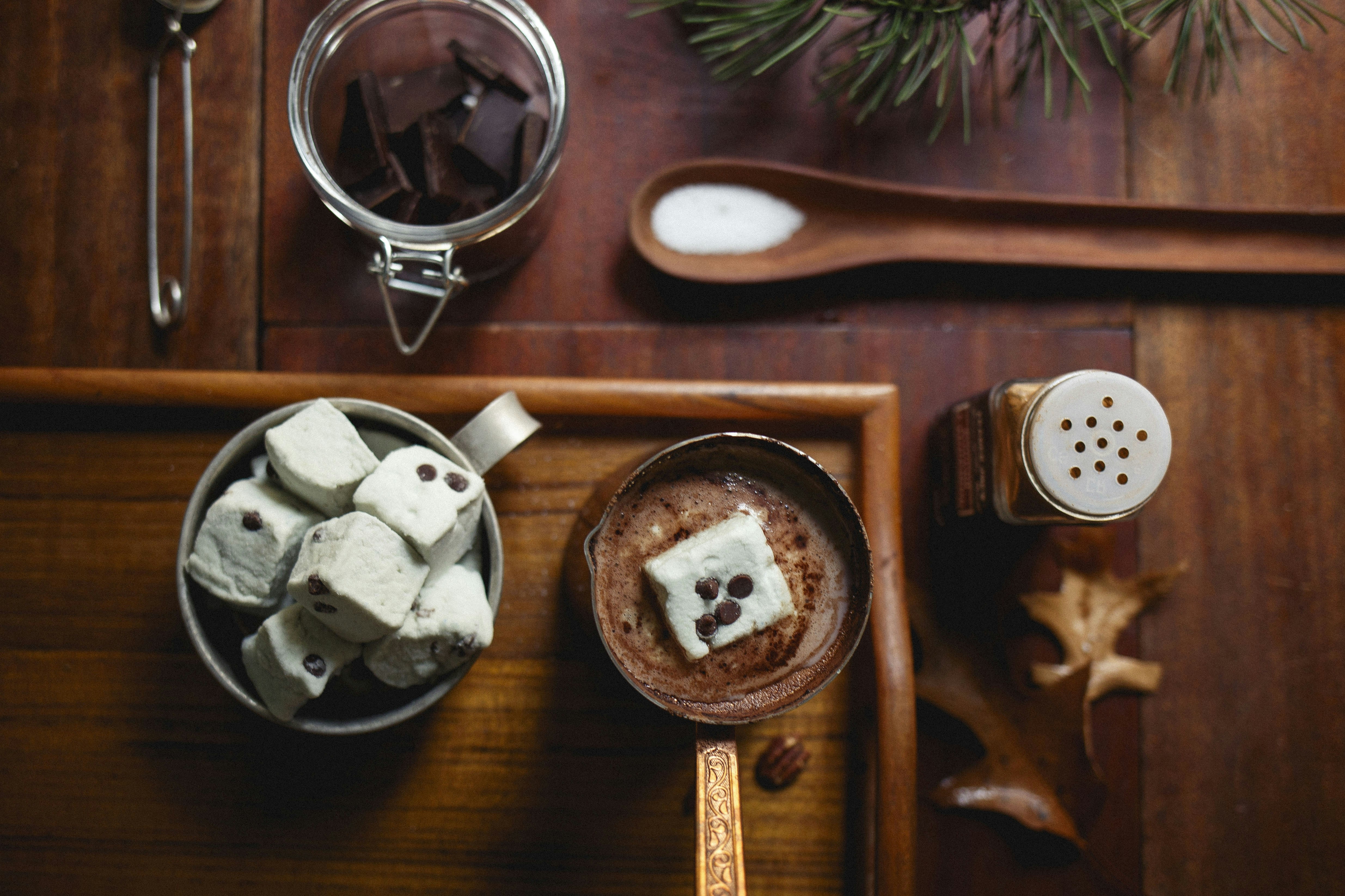 cooked dishes on brown wooden table hot chocolate teams background