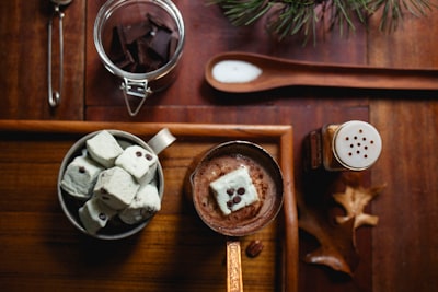cooked dishes on brown wooden table hot chocolate teams background