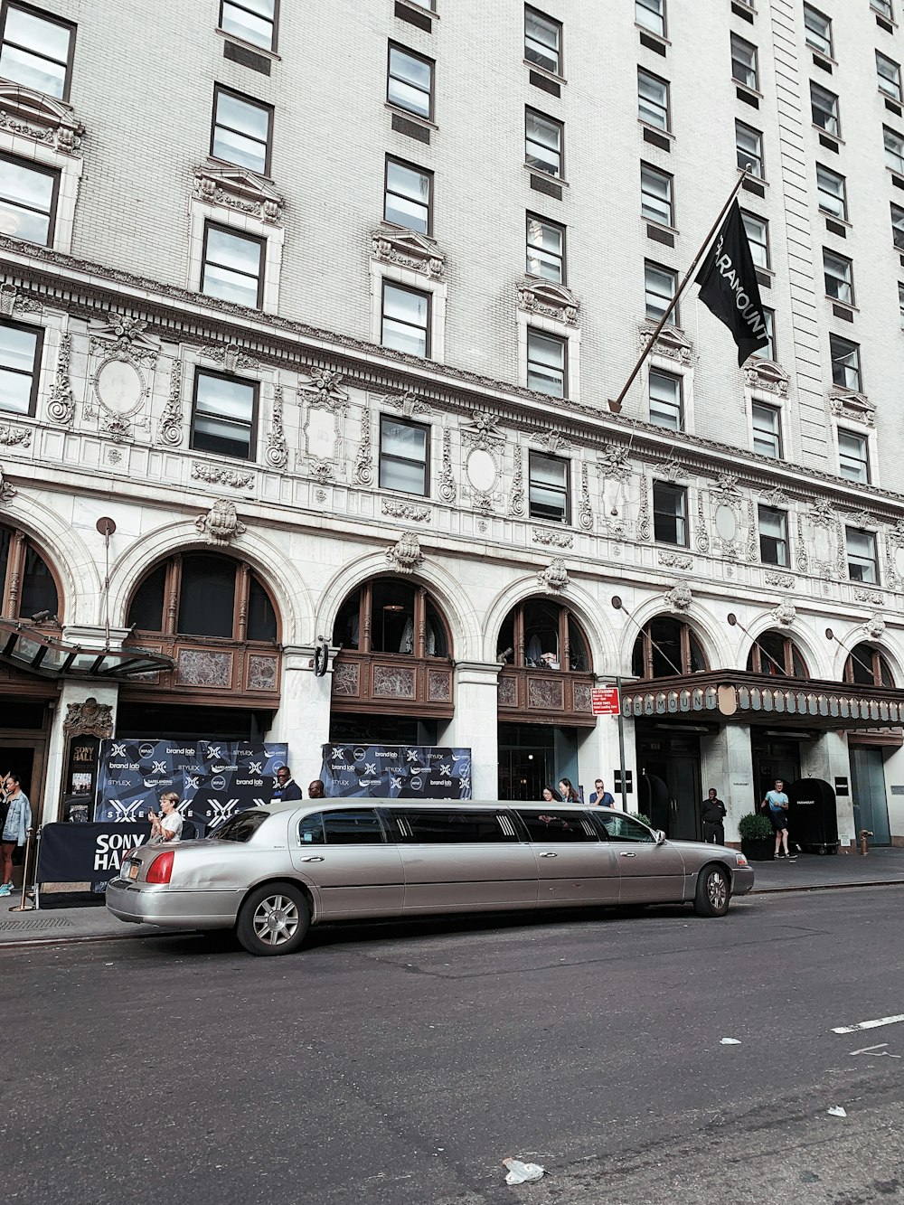 silver limousine near hotel
