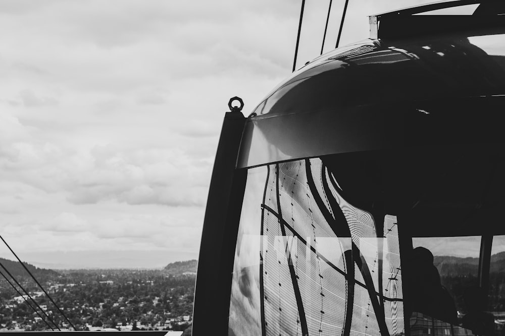 a black and white photo of a cable car