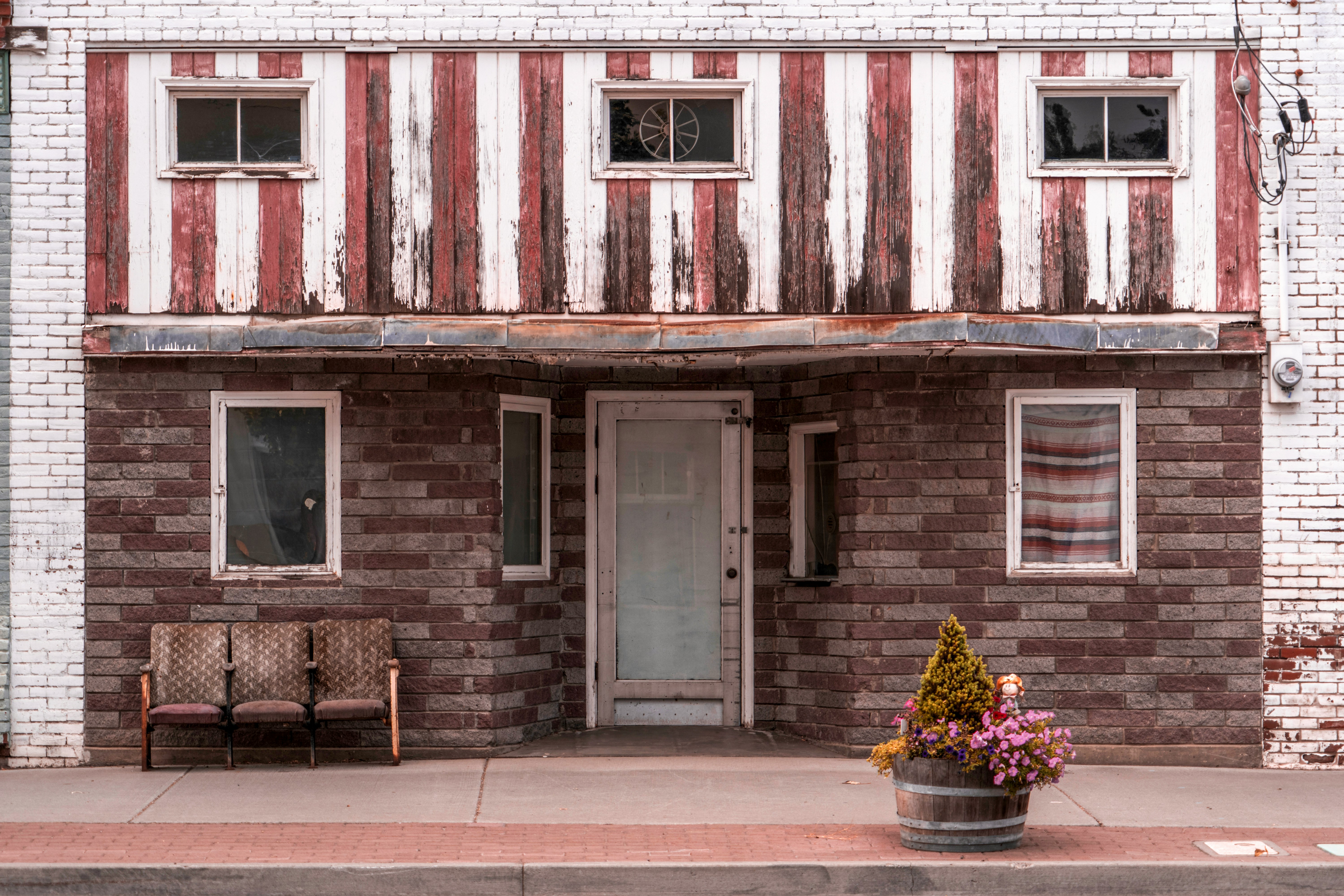 Read the Walls: What Ghost Signs and Crumbling Storefronts Are Trying to Tell You From the Motel Parking Lot
