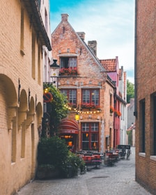 a cobblestone street lined with brick buildings