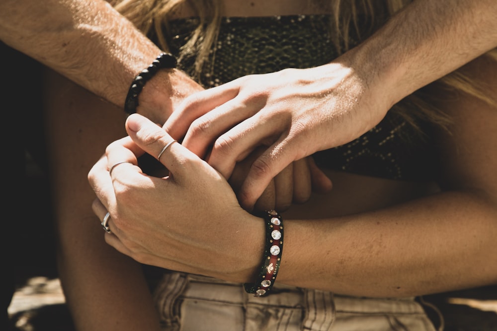 man and woman holding hands