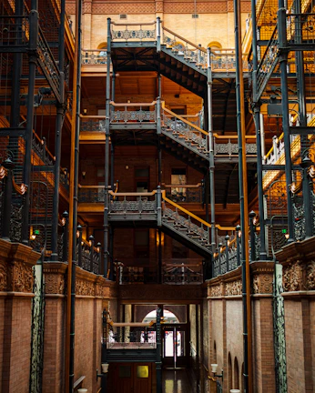 A sleek aluminium and iron staircase with intricate design details in a newly renovated home.