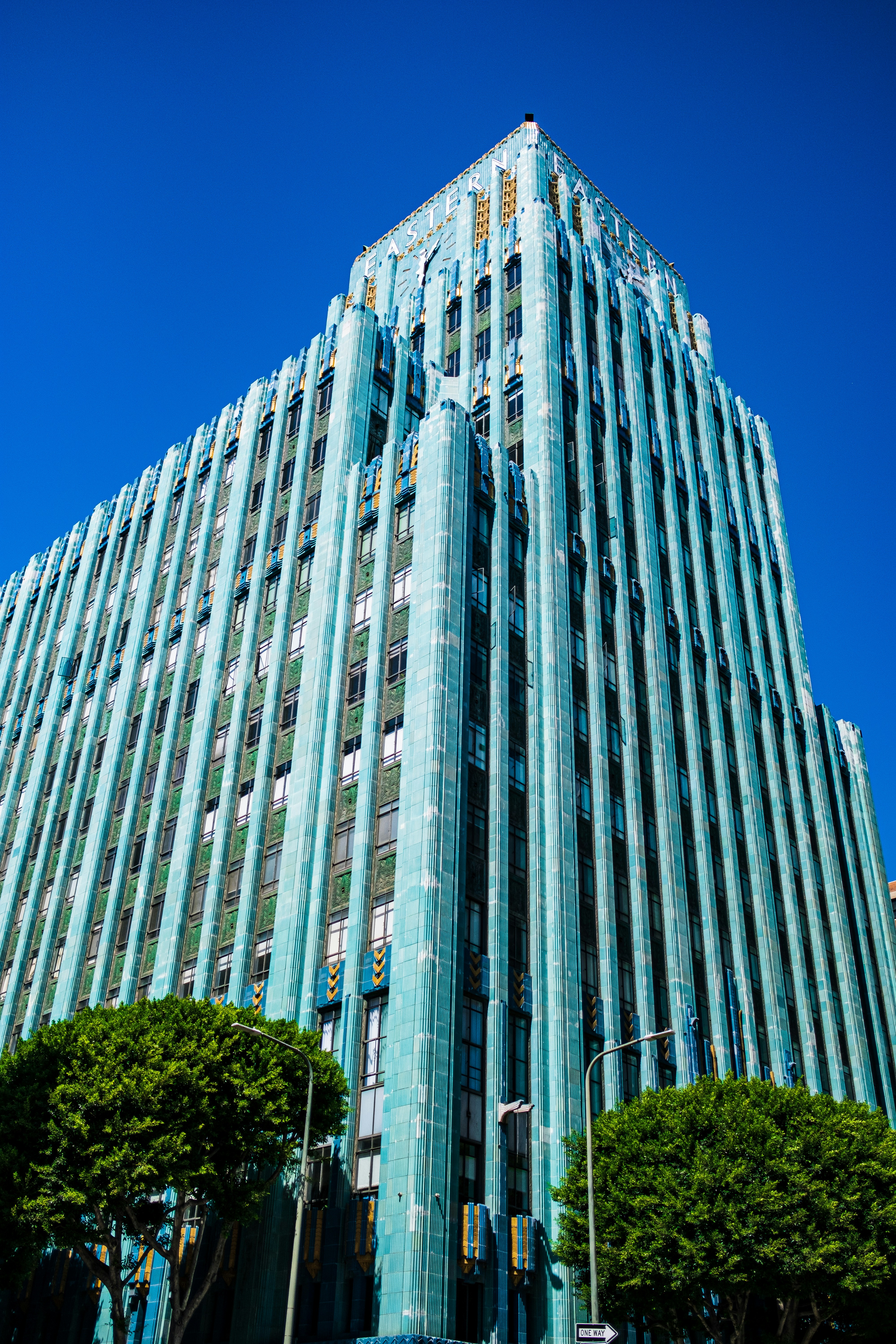 low angle photography of gray concrete mid-rise building during daytime