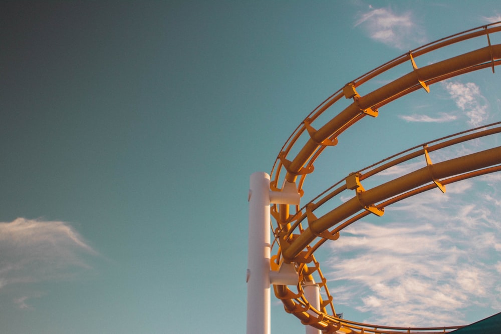 a roller coaster with a sky background