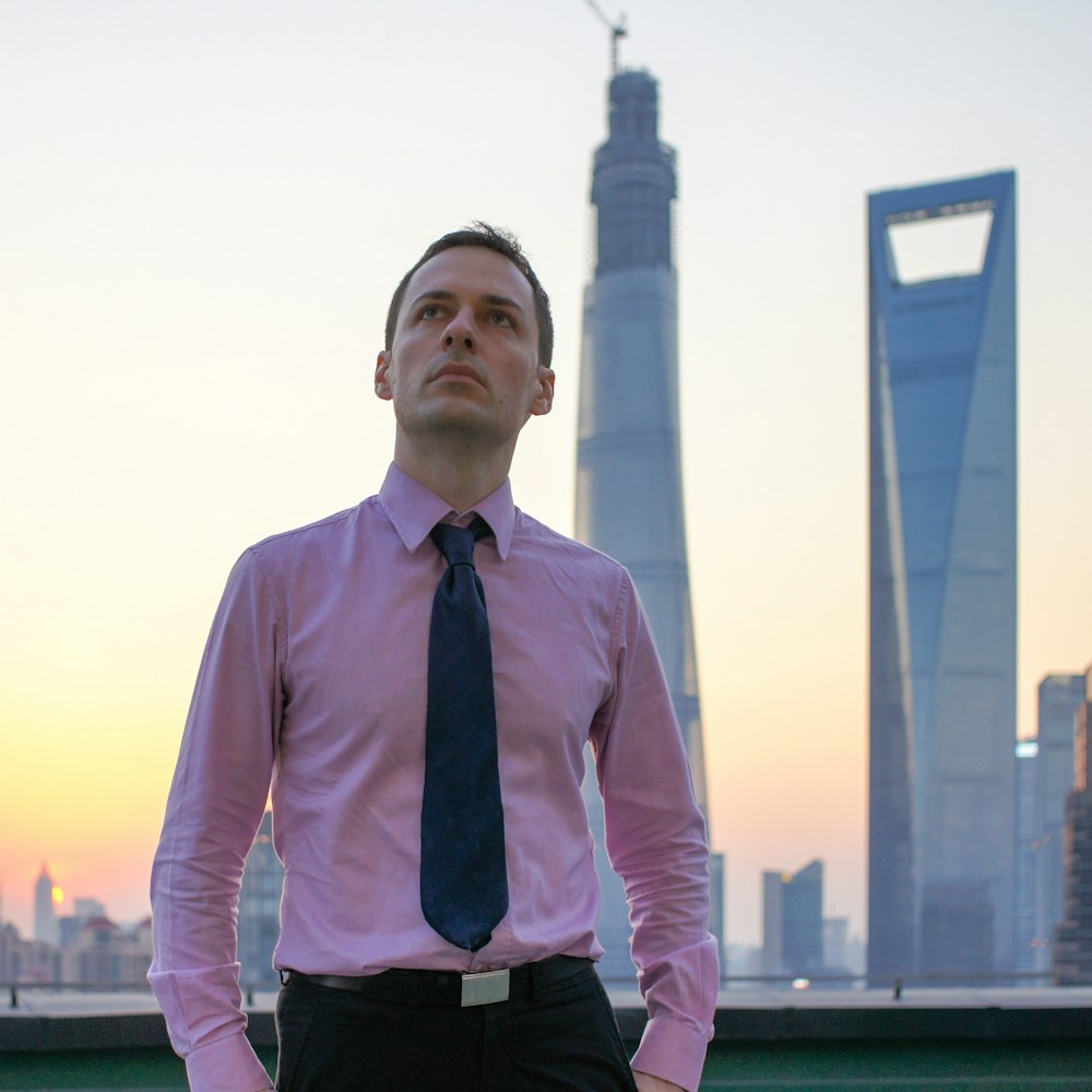 man standing on green wall