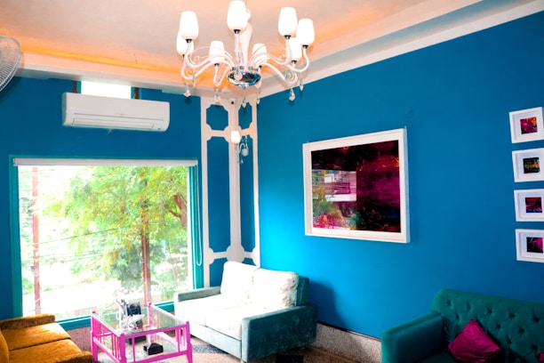 A cozy living room with modern air conditioning unit installed on the wall.