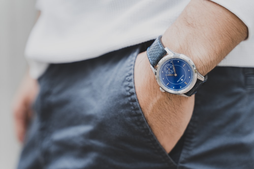 round silver-colored analog watch