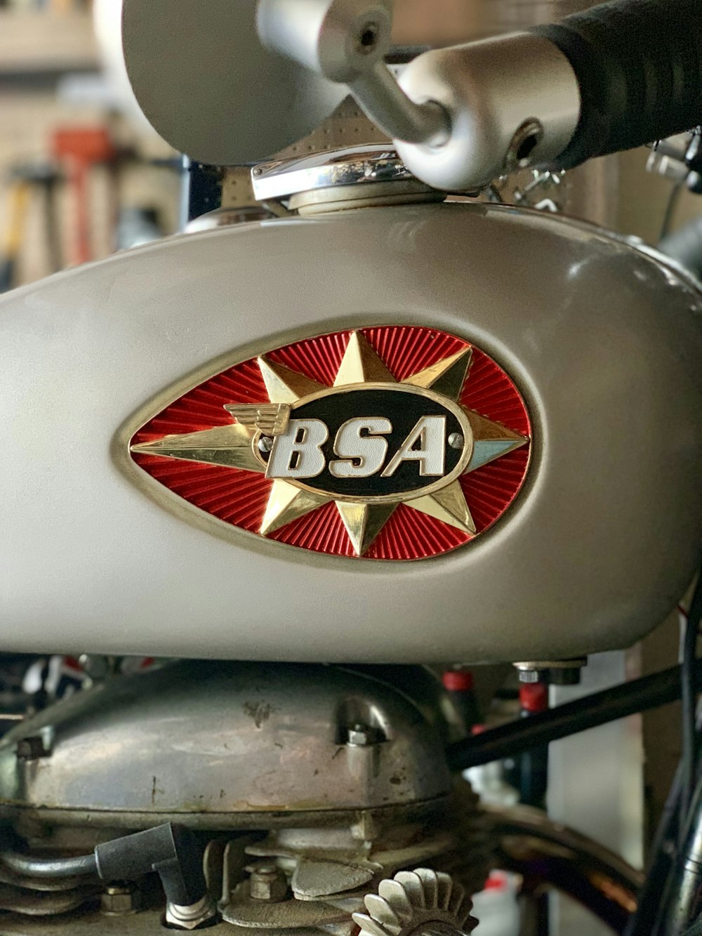 grey and red BSA motorcycle