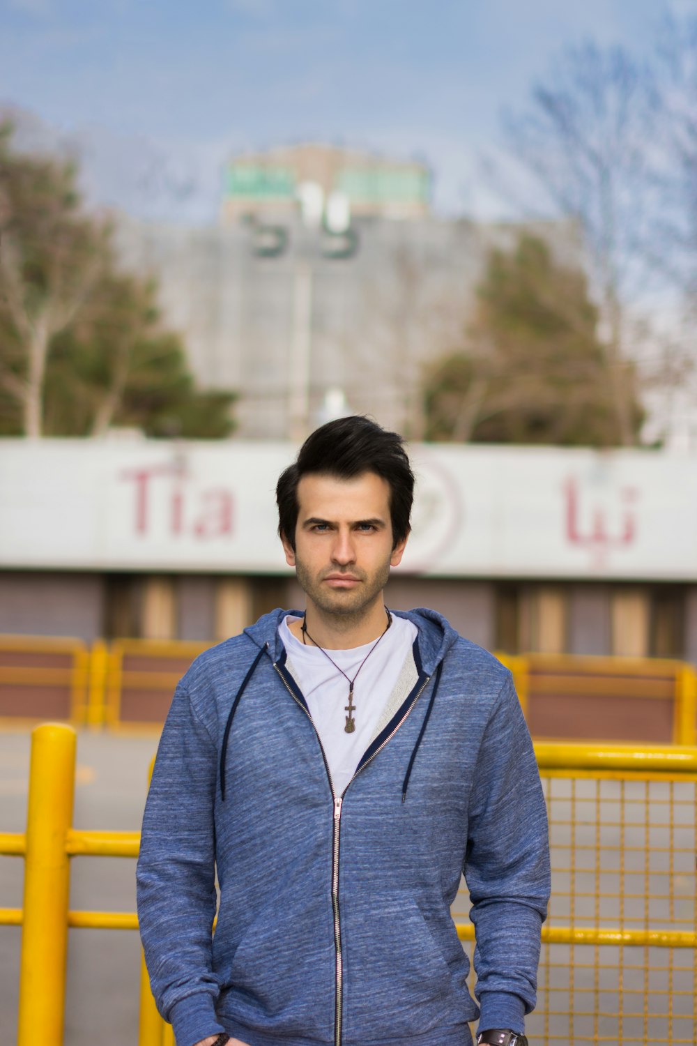 man in blue zip-up jacket