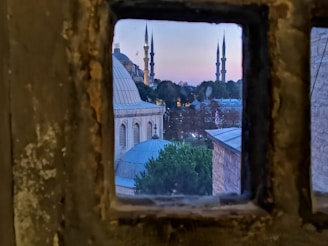 A serene view of a historic mosque in Turkey bathed in golden morning light.