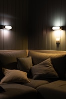 A cozy corner with a plush sofa and decorative cushions.