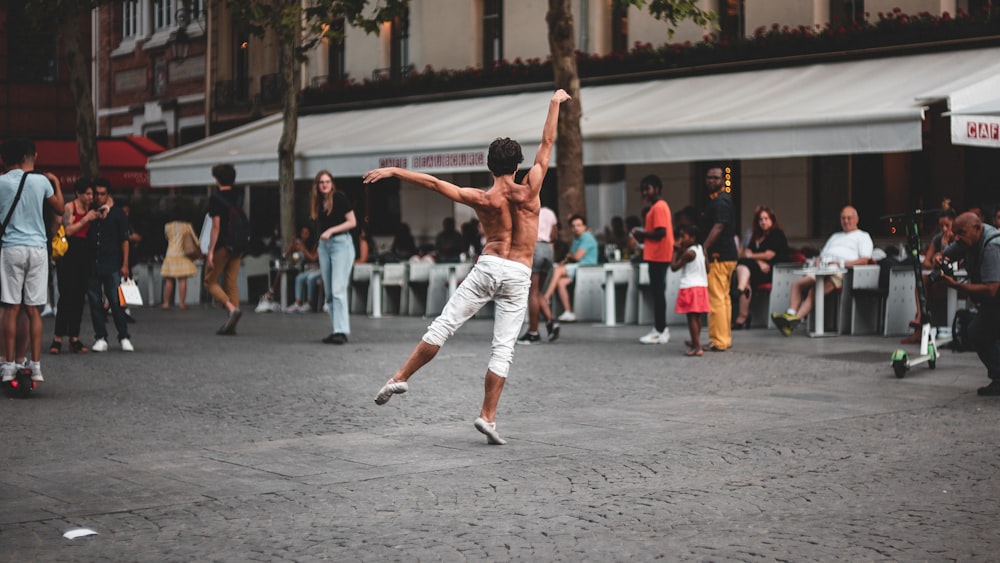 man dancing on concrete ground