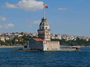 a large tower with a flag on top of it