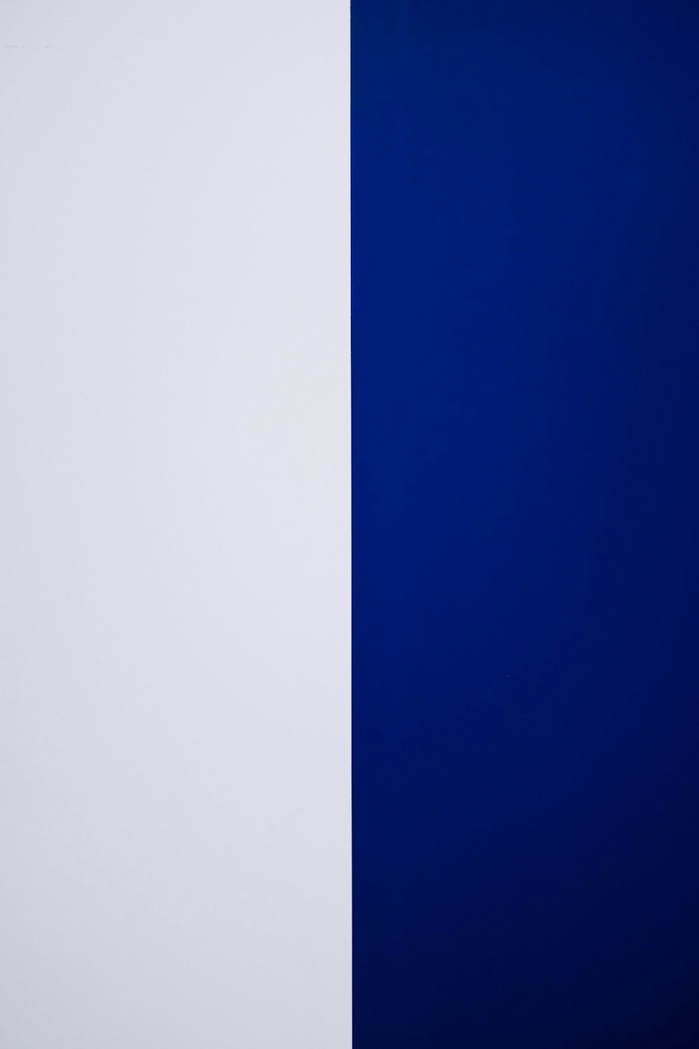 a white and blue wall next to each other