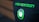 A black shirt features pixelated green text reading 'HACKERNOON' above a pixel art design of a green and white plug icon.
