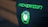 A black shirt features pixelated green text reading 'HACKERNOON' above a pixel art design of a green and white plug icon.