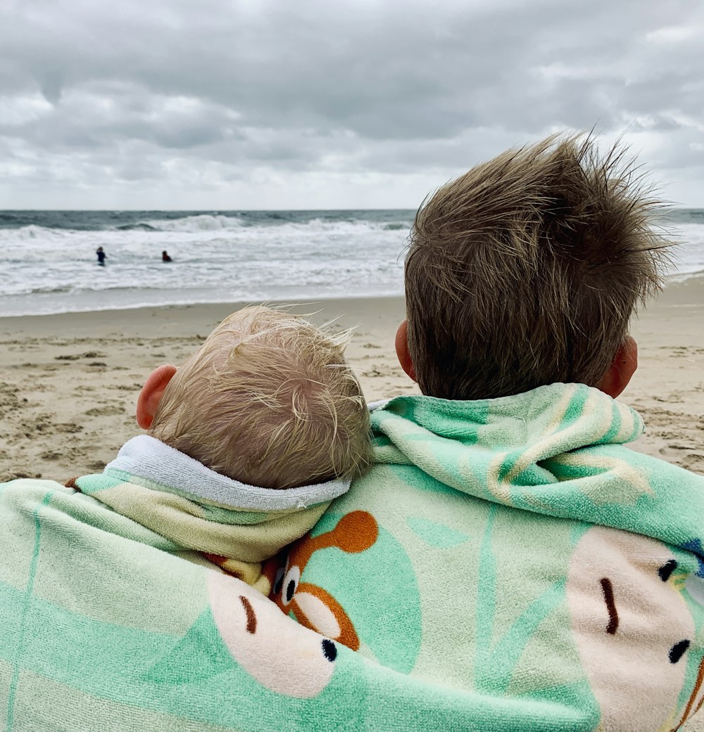 two boys sitting on seahote