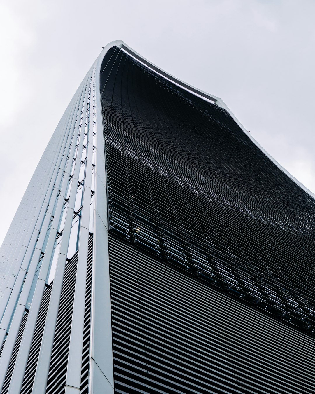 low angle photo of gray concrete building