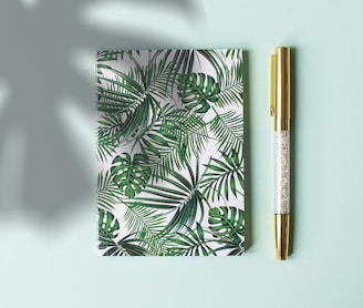 green floral covered notebook