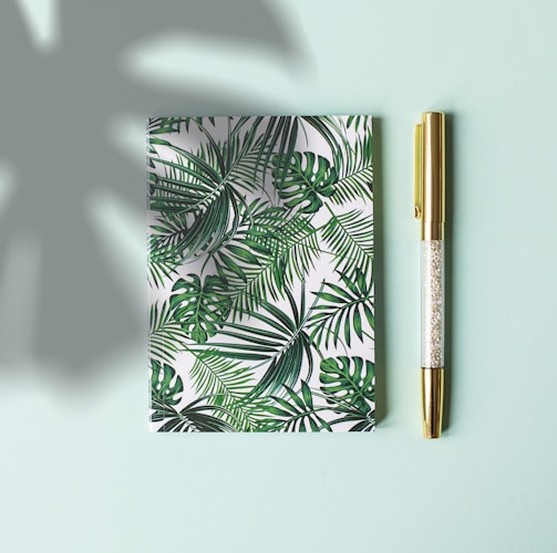 green floral covered notebook