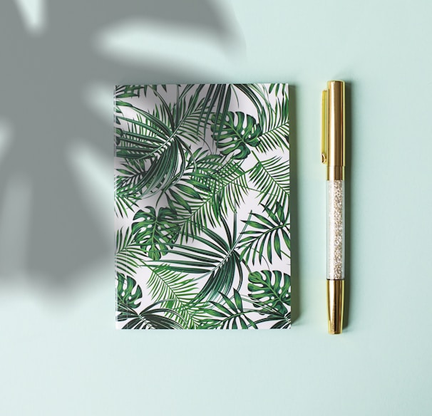 green floral covered notebook