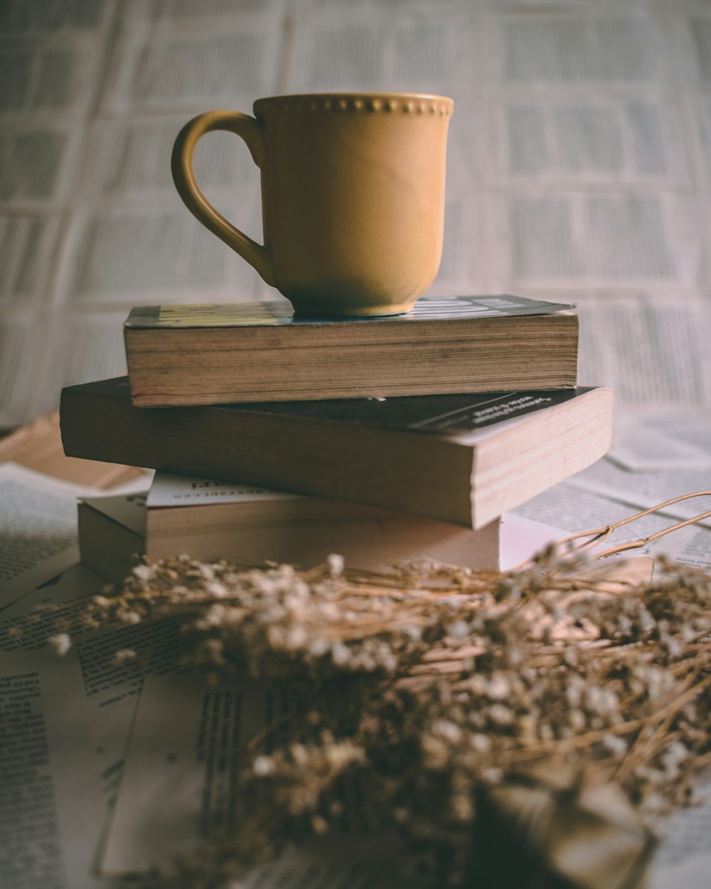 brown ceramic mug on book