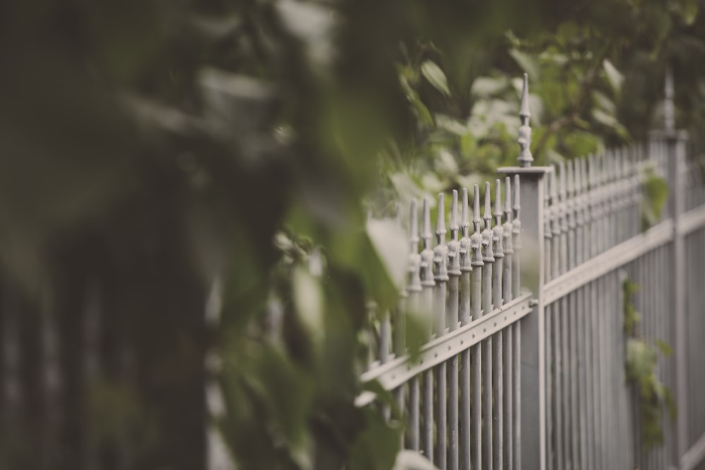 a metal fence with a light on top of it